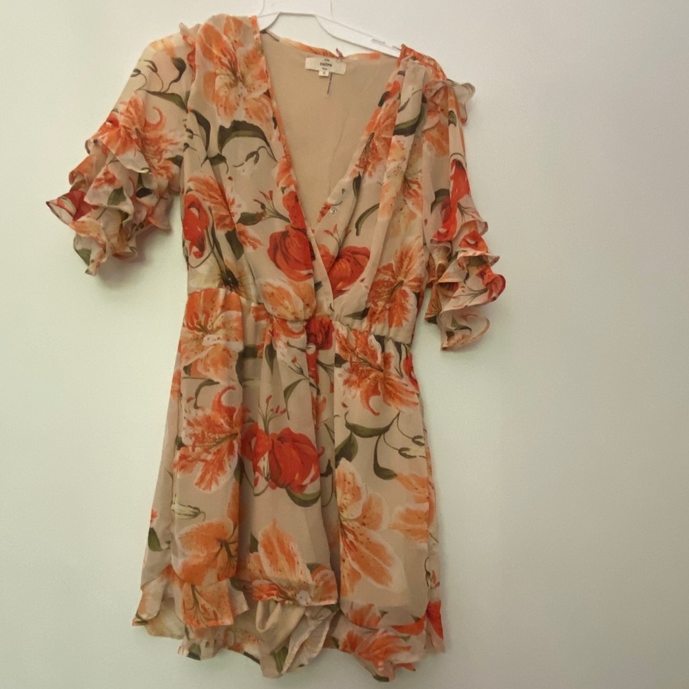 NWT nude floral romper with ruffle sleeves